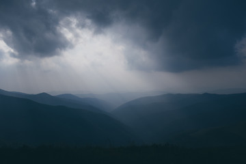 Sun from clouds in Mountains