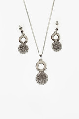 Fototapeta na wymiar beautiful women jewelry set necklace and earrings on white