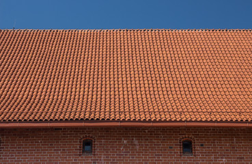 Fototapeta premium Tiles on old castle roof, architecture background.