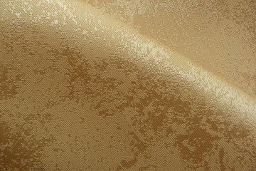 gold brocade fabric close-up natural linens creases padding oriental luxury shiny threads vintage organza curtains background for decor textured material uneven surface silk