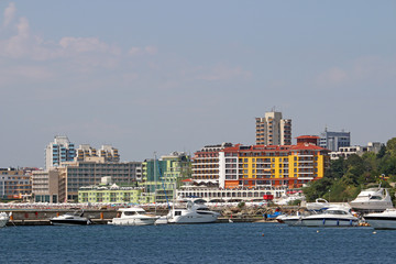 Fototapeta na wymiar port with yachts and hotel buildings cityscape Nessebar Bulgaria
