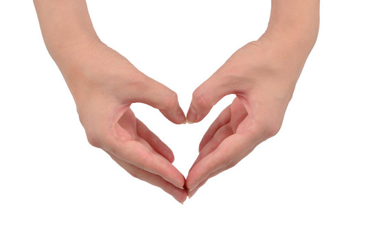 Close up of heart made by women hands with pale skin isolated on over white background