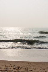 Glistening waves on beach - Glistening sea waves on a tropical beach in the morning.