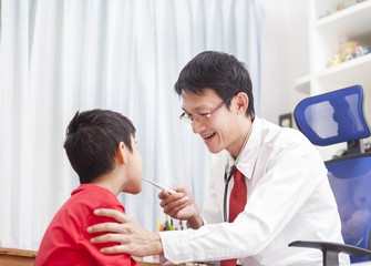 Portrait of proud doctor with stethoscope.doctor examining a child patient by stethoscope..