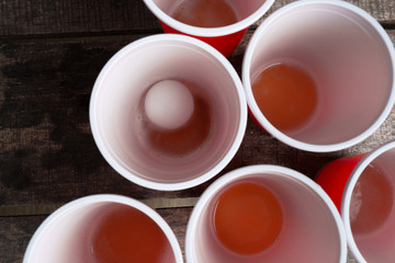Game Beer Pong on wooden table