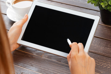 woman holding digital tablet, closeup