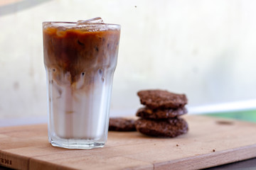 cup of coffee and cookies on table