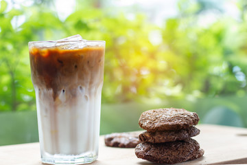cup of coffee and cookies on wooden table