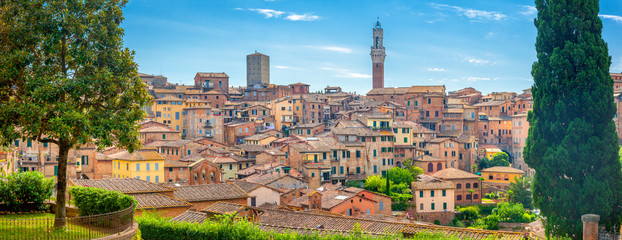 A view of the old city and the towering cathedral in one of the most beautiful cities of Tuscany Siena. Italy. Europe - obrazy, fototapety, plakaty