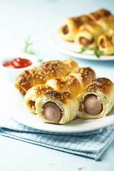 Homemade sausage rolls with sesame seeds