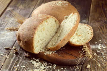 baked bread on wooden table background