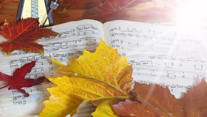 sheet music and autumn leaves