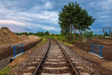 Fototapeta na wymiar Landscape with railroad tracks in Poland