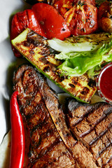 Grilled Steak On Table In Restaurant Closeup