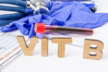 Vit B vitamin B acronym or abbreviation diagnostics or medical laboratory test photo concept. Word Vit B is background of blood sample in test tube, protective gloves and hematological blood analysis