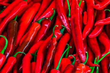 Red hot chilli peppers pattern texture background. Close up. Landscape. A backdrop ofRed hot chilli peppers. Street vegetable market. Group of Red hot chilli peppers