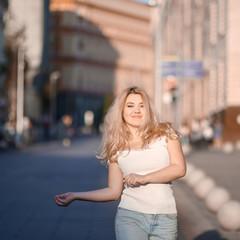Portrait Beautiful young blonde girl in sunglasses with puffy lips and sexy feminine body posing on...