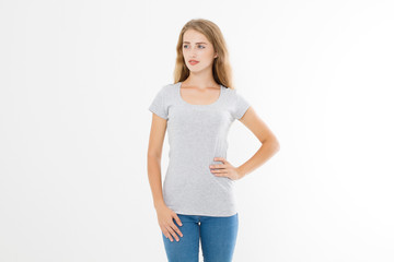 Young blonde woman with fit slim body in blank template t shirt and jeans isolated on white background. Skin and hair care. Copy space and mock up