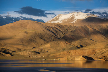 Panorama of sunset at Tso Moriri lake with beautiful mountains around located near Karzok village in Rupshu valley in Ladakh, India