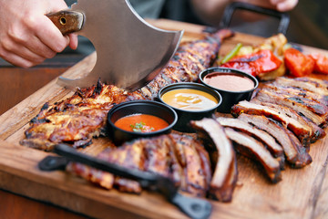 Meat Food. Barbecue Ribs And Sauces In Restaurant
