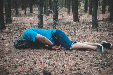 corpse of a man in the woods