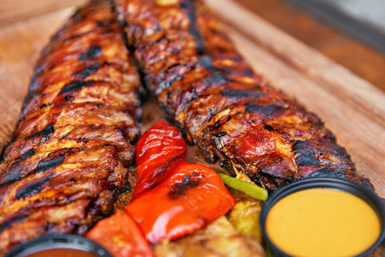 Food. Grilled Meat And Vegetables With Sauce Closeup