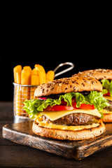 Delicious grilled burgers © George Dolgikh