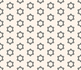 Vector seamless pattern with simple small geometric snowflakes. Black and white
