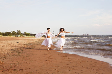 Two white angels on the beach