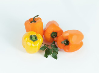 bell pepper and sprig of parsley .isolated on a white background