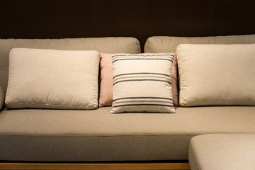 Modern fabric pillow on luxury brown fabric sofa interior decoration