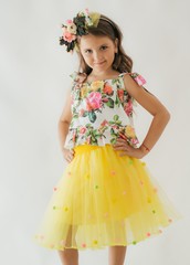 Little happy girl in  fashion dress