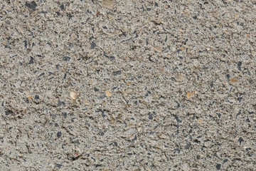 closeup on concrete, small pebbles, background