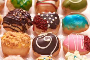 Close-up view of delicious doughnuts in  box