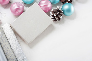 Pink and blue Christmas balls with gift box and wrapping paper