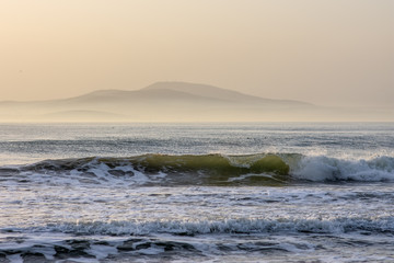Fototapeta na wymiar Morning with big waves on the beach