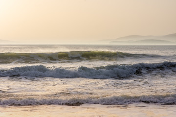 Morning with big waves on the beach
