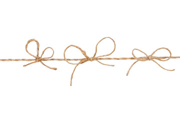 Three bow knots on a linen rope string isolated over the white background