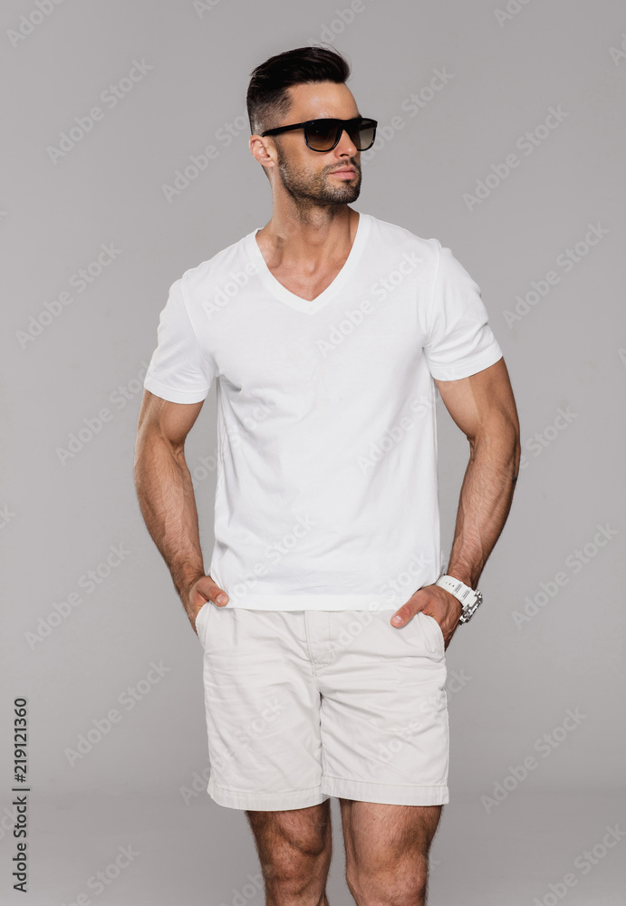 Poster handsome man in summer clothes wear sunglasses