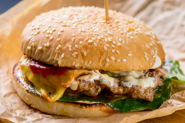 burger with steak and flowing sauces