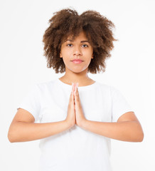 Close-up of hands of black, afro american woman in white clothes meditating indoors, focus on arms...