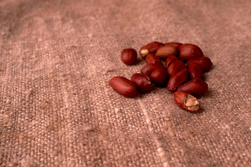 peanut hill Deep fried peanuts over rustic wicker background. emptiness place. Space for text. copyspace