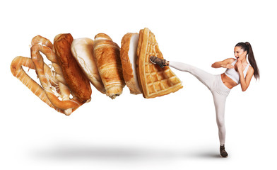 Fit young woman saying NO to unhealthy carbohydrates  