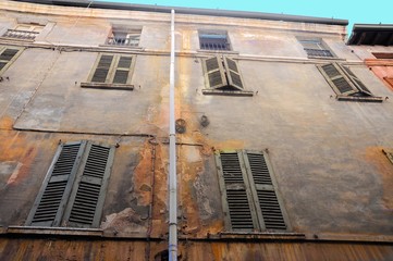 Old and damaged uninhabited building facade. - 219127966