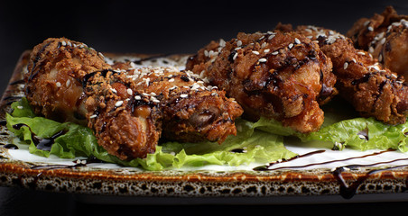 Chicken legs with a crispy crust on a plate