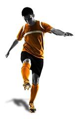 Fototapeta na wymiar one brazilian soccer football player young man kicking in