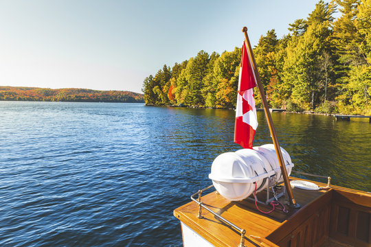 Canada, Ontario, Canadian flag on a boat on a lake in Algonquin park
