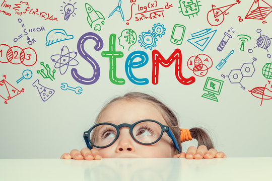 STEM word and symbols over beautiful cute little girl. modern education concept