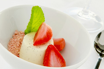 vanilla panna cotta dessert with strawberries
