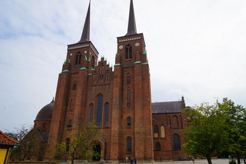 Roskilde Cathedral is a cathedral of the Lutheran Church of Denmark. The first Gothic cathedral to be built of brick, it encouraged the spread of the Brick Gothic style throughout Northern Europe